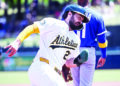 Athletics use timely hits, stellar bullpen to claim series win against Royals