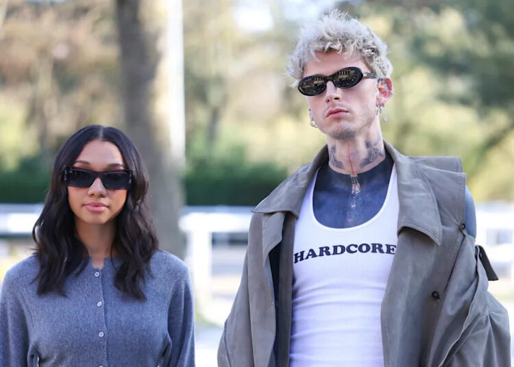 Casie Colson Baker and Machine Gun Kelly (R) attend the Stella McCartney Womenswear Fall/Winter 2026-2027 show as part of Paris Fashion Week on March 04, 2026 in Paris, France.