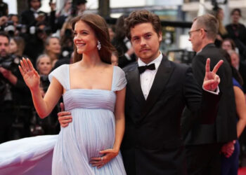 Barbara Palvin, left, and Dylan Sprouse pose for photographers upon arrival at the premiere of the film 'Parallel Tales' at the 79th international film festival, Cannes, southern France, Thursday, May 14, 2026. (Photo by Scott A Garfitt/Invision/AP)