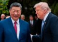 U.S. President Donald Trump speaks with Chinese President Xi Jinping while leaving after a visit to the Zhongnanhai Garden in Beijing, Friday, May 15, 2026.