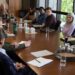 A group of college professors around a conference table