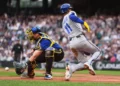 Seattle Mariners catcher Cal Raleigh misses the throw at the plate and Kansas City Royals' Maikel Garcia (11) scores on an RBI single from Vinnie Pasquantino during the first inning of a baseball game, Friday, May 1, 2026, in Seattle. (AP Photo/Lindsey Wasson)