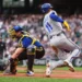 Seattle Mariners catcher Cal Raleigh misses the throw at the plate and Kansas City Royals' Maikel Garcia (11) scores on an RBI single from Vinnie Pasquantino during the first inning of a baseball game, Friday, May 1, 2026, in Seattle. (AP Photo/Lindsey Wasson)