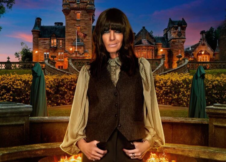 A woman with black hair standing outside a castle.