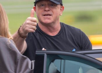 Ross threw a thumbs up at the camera as he climbed into the car