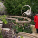 A Chelsea pensioner views the Parkinson's UK - A Garden for Every Parkinson's Journey during press day at the RHS Chelsea Flower Show, at the Royal Hospital Chelsea in London. Picture date: Monday May 18, 2026. PA Photo. Photo credit should read: