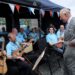 The King chatted to members of the Loughries Men’s Shed Ukulele Ensemble during his visit (Toby Melville/PA)