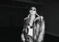 Charli XCX walks Paris runway "straight to hell" on gritty new single 'SS26'