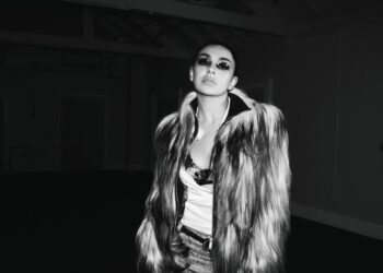 Charli XCX walks Paris runway "straight to hell" on gritty new single 'SS26'
