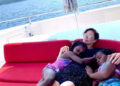 Charlize Theron hugging her daughters on a boat.Credit: Charlize Theron/Instagram