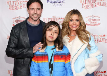 Denise Richards, right, poses with daughter Eloise Joni Richards, center, and estranged husband Aaron Phypers at the 91st anniversary of the Hollywood Christmas Parade on Nov. 26, 2023.