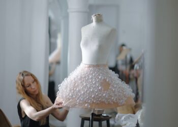 Fashion design process with a unique bubble skirt on a mannequin.