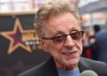 Frankie Valli smiling at his Hollywood Walk of Fame ceremony.