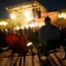 Bob Roark, right, and Penny Machmer, left, watch the Beach Boys perform from ADA accessible seating areas at Levitt Pavilion in Denver on Aug. 14, 2024. (Photo by Helen H. Richardson/The Denver Post)