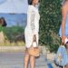 Gabrielle Union wears a white lace dress and carries a rare Prada Moon Buckle Bag