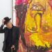 German artist Georg Baselitz poses with his work 'Schwester Rosi III' (1995) in 2018.