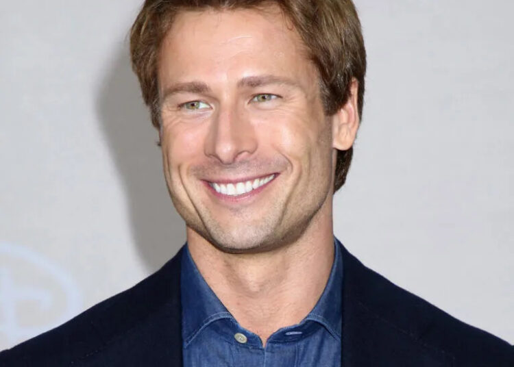 Glen Powell smiling