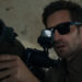 Jake Gyllenhaal as Bronco holding a bazooka in In the Grey