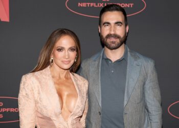 Jennifer Lopez and Brett Goldstein pose together at the 2026 Netflix Upfront at Sunset Pier 94 Studios