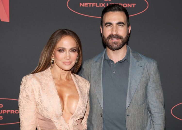 Jennifer Lopez and Brett Goldstein pose together at the 2026 Netflix Upfront at Sunset Pier 94 Studios