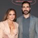 Jennifer Lopez and Brett Goldstein pose together at the 2026 Netflix Upfront at Sunset Pier 94 Studios