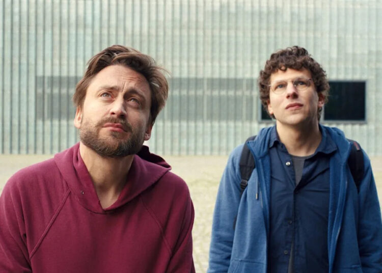 This image released by Searchlight Pictures shows Kieran Culkin, left, and Jesse Eisenberg in a scene from "A Real Pain." (Searchlight Pictures via AP)
