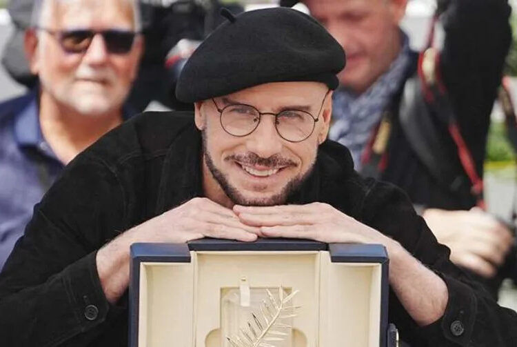 John Travolta has been wearing berets around Cannes. By: ZUMAPRESS.com / MEGA