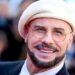 John Travolta explains headgear choice after plastic surgery rumors - Celebrity News - Entertainment