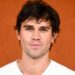 KJ Apa rocks a pair of wet undies poolside in viral new pic
