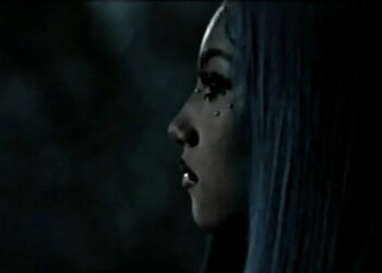 North West was seen in a new music video wearing faux under-eye piercings (above). YouTube/North West