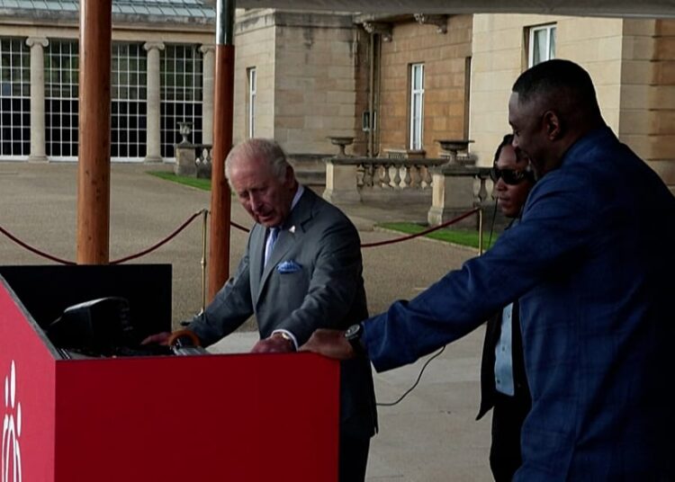 King Charles and Idris Elba share the DJ stage at royal garden party
