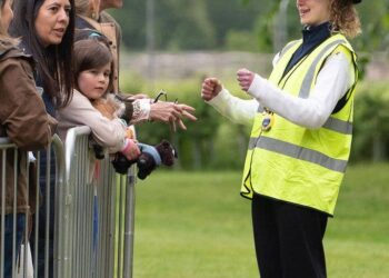 Prince Edward laughing as Lady Louise Windsor makes geatures with her hands