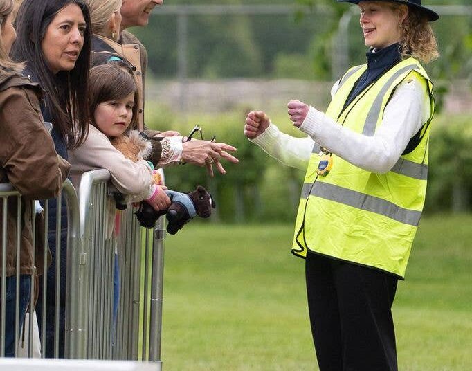 Prince Edward laughing as Lady Louise Windsor makes geatures with her hands