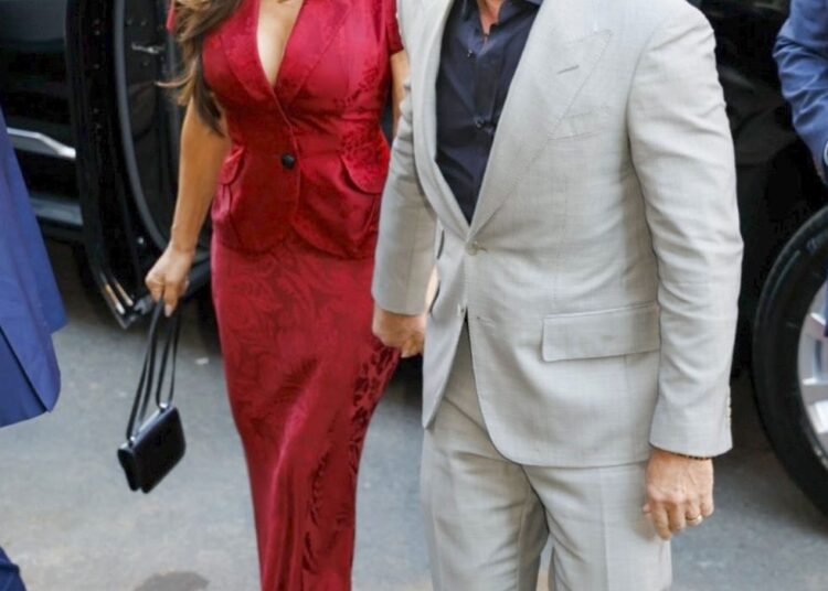 Formal attire worn by individuals exiting a vehicle.