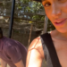 Two individuals engaged in an outdoor activity in a shaded area.