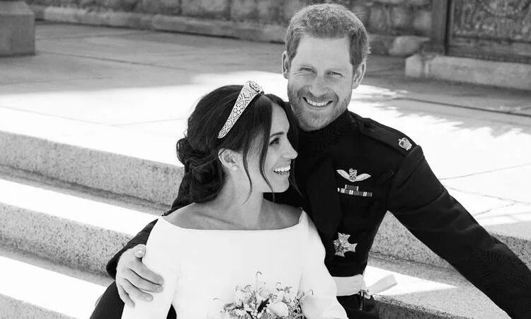 Meghan Markle and Prince Harry pose together on their wedding day in 2018. By: MEGA