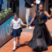 Naomi Osaka of Japan enters the court wearing a dress designed by Kevin Germanier for her match against Laura Siegemund of Germany on day three at Stade Roland Garros.