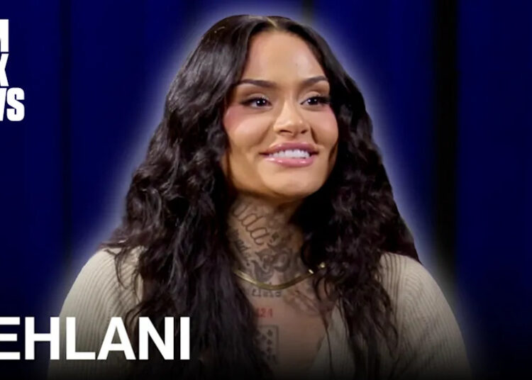 Kehlani on Complex News, smiling with long wavy hair and visible tattoos, against a blue background.