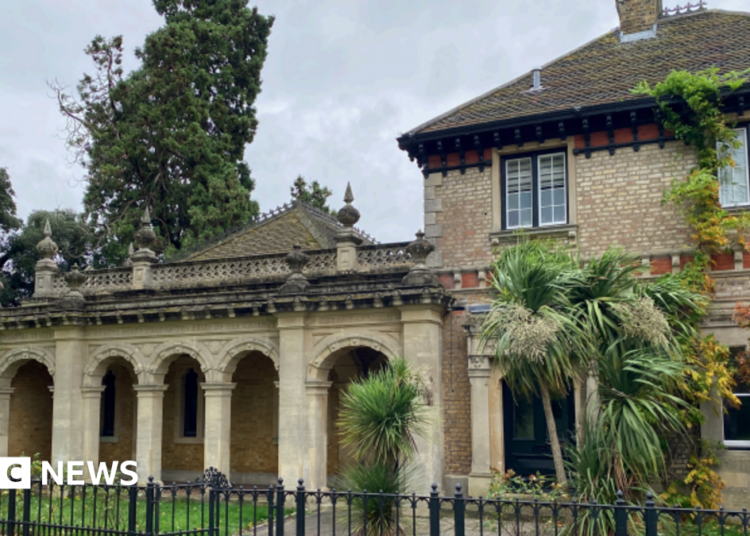 A general view picture of the cottage, a two storey building with trees outside it, and the Royal Dairy linked to it on the left.