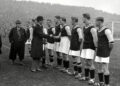 King George VI greets Aston Villa's players ahead of their game against Bolton Wanderers at Villa Park in 1924
