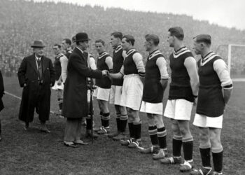 King George VI greets Aston Villa's players ahead of their game against Bolton Wanderers at Villa Park in 1924