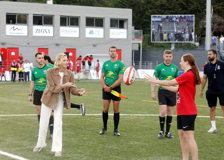 Princess Charlene catching a rugby ball