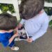 The couple's two sons August, 5, and Ernest, 2, look at the pregnancy scan of their younger sibling.