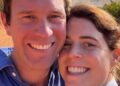 Princess Eugenie and her husband smiling on a beach