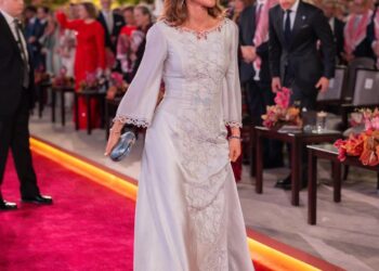 Image may contain Queen Rania of Jordan Person Fashion Adult Wedding Accessories Formal Wear and Tie