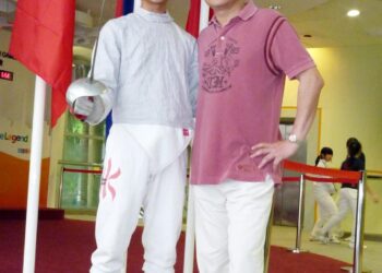 Jackson Wang with his father in 2010. Before he became a singer, Wang was a champion fencer. Photo: SCMP
