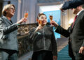 Elim Chan, center, the San Francisco Symphony's music director designate, celebrates with San Francisco Symphony leaders and musicians during an event announcing her as the orchestra's next music director at San Francisco City Hall on Thursday, May 21, 2026. (Jana Ašenbrennerová/For the S.F. Chronicle)