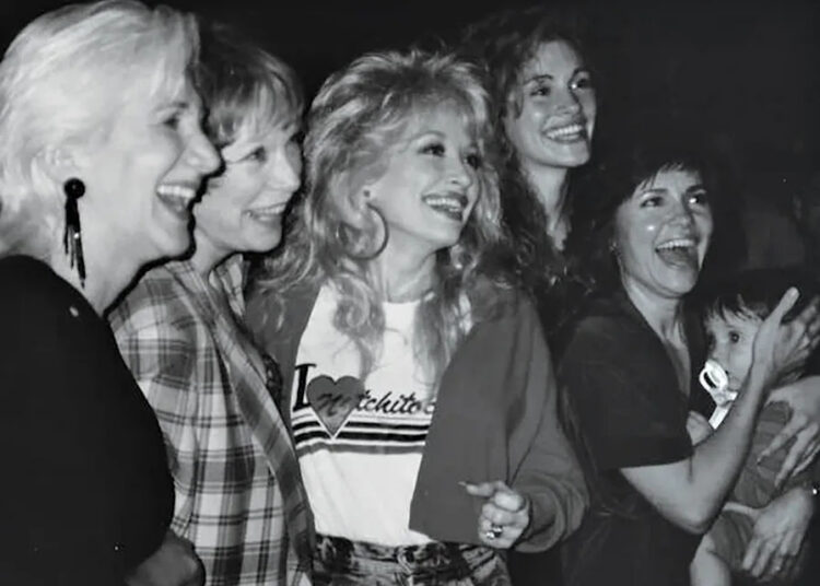 Sally Field shares a personal photo from the wrap party of 'Steel Magnolias' in which she's holding six-month-old Sam alongside Olympia Dukakis, Shirley MacLaine, Dolly Parton and Julia RobertsCredit: Courtesy Sally Field