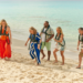 The 2026 cast of Shark! on the beach in the Bahamas