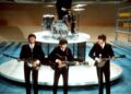 The band The Beatles performing.